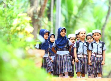 Children learning to read and write in Arabic, English, and Malayalam at Zeeque Preschool, Kerala.