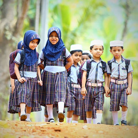 Children participating in structured outdoor play and sports activities at our Kerala preschool campus.